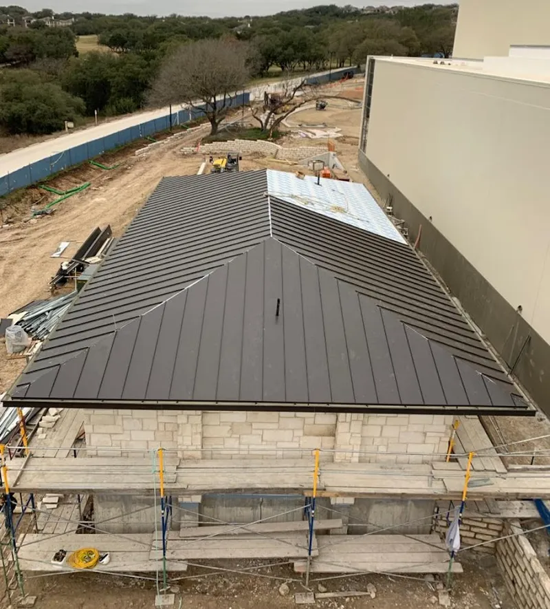 Metal roof new construction with scaffolding in Bensville